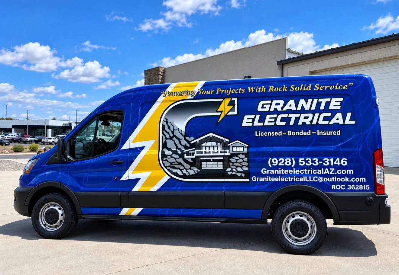 A Granite Electrical Ford Transit van in its finished blue and yellow wrap