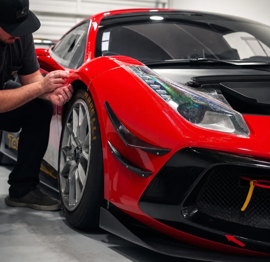 Paint protection film being applied to a Ferrari at Auto Trim Plus