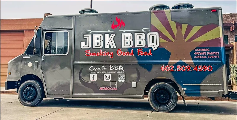The JBK BBQ food truck in a full wrap with flame and Arizona flag artwork