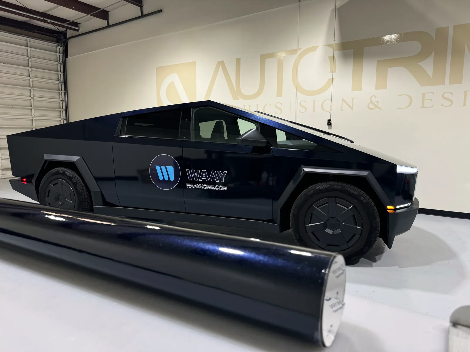 A Tesla Cybertruck carrying WAAY branding, wrapped at Auto Trim Plus