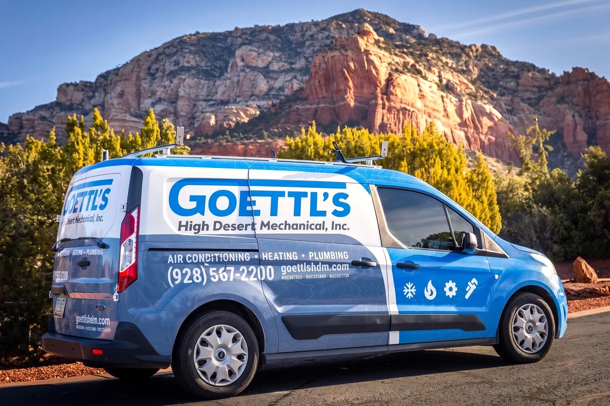 Goettl&rsquo;s High Desert Mechanical service van in a full-color fleet wrap, parked below Arizona red rock