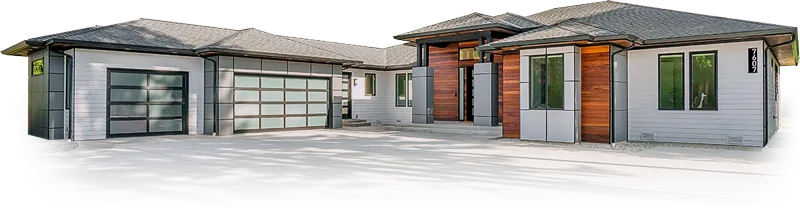 A single-storey home with large ground-floor windows and glass garage doors
